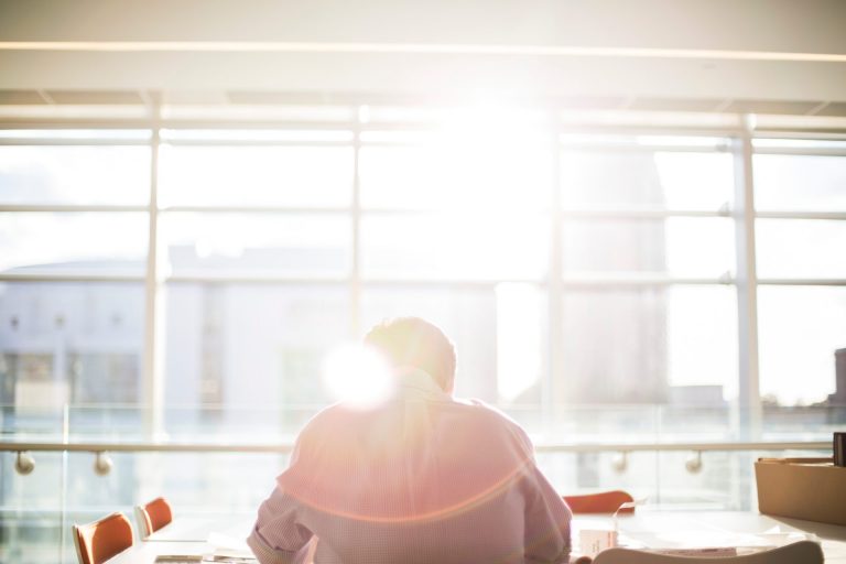 person sitting in bright office